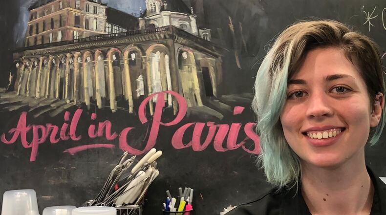 Carina Colvin loved to draw when growing up near Springfield. Now 24-year-old, Colvin's chalk drawings appeal to visitors to Current Cuisine deli and catering in Yellow Springs. CONTRIBUTED