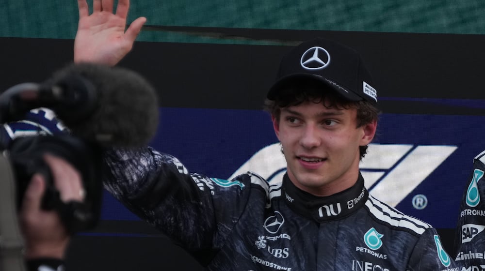 Mercedes driver Kimi Antonelli of Italy waves after the qualifying session of the Japanese Formula One Grand Prix at the Suzuka Circuit in Suzuka, Japan, Saturday, March 28, 2026. (AP Photo/Hiro Komae)
