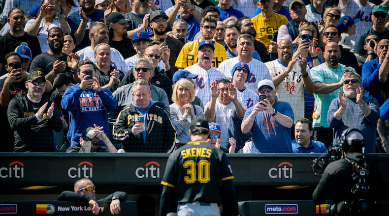 The crowd cheers and jeers as Pittsburgh Pirates pitcher Paul Skenes (30) exits the field after he was relieved in the first inning of an opening-day baseball game against the New York Mets, Thursday, March 26, 2026, in New York. (AP Photo/Angelina Katsanis)