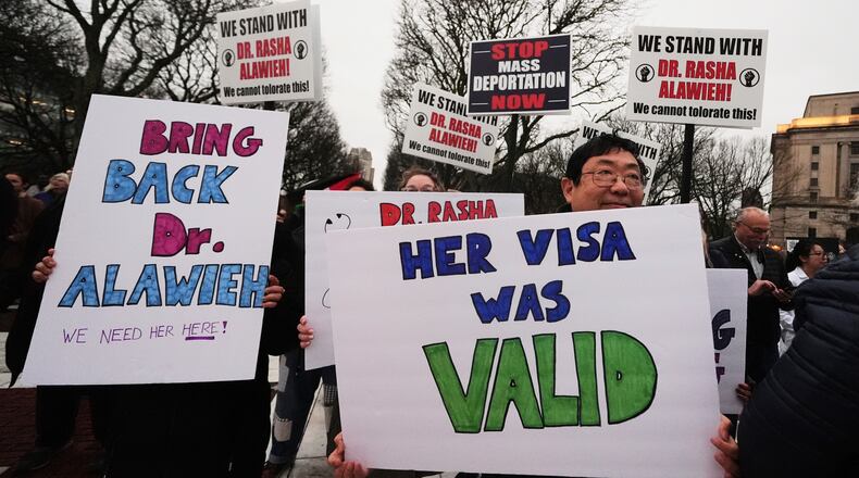 FILE - Protesters rally outside the Rhode Island State House in support of deported Brown University Dr. Rasha Alawieh, March 17, 2025, in Providence, R.I. (AP Photo/Charles Krupa, File)