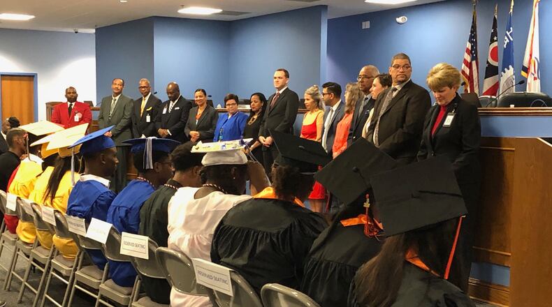 Dayton Public Schools Class of 2019 summer graduates are recognized by the school board and administration. JEREMY P. KELLEY / STAFF
