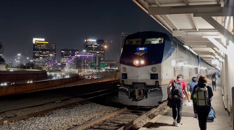 This image made from an Associated Press video shows passengers boarding the Amtrak Crescent headed towards New York on Thursday, March 26, 2026, in Atlanta. (AP Photo/Bill Barrow)