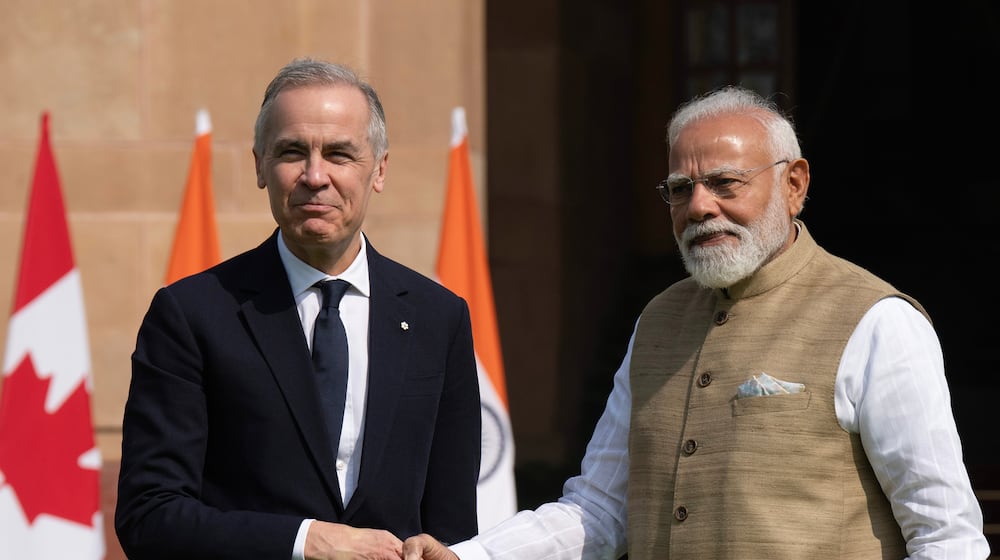 Canada's Prime Minister Mark Carney, left, meets Indian Prime Minister Narendra Modi at Hyderabad House in New Delhi, Monday, March 2, 2026. (Adrian Wyld/The Canadian Press via AP)