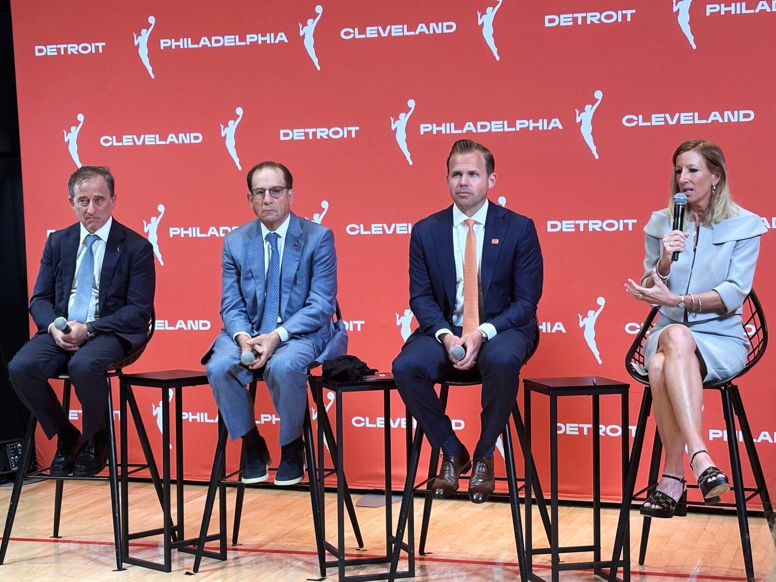 Josh Harris, left, managing partner of the Philadelphia 76ers, Arn Tellem, Detroit Pistons vice chairman, Nic Barlage, representing the Cleveland Cavaliers, listen as WNBA commissioner Cathy Engelbert speaks during a news conference, Monday, June 30, 2025, in New York, announcing WNBA basketball expansion teams in Philadelphia, Detroit and Cleveland. (AP Photo/Doug Feinberg)