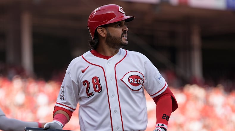 Cincinnati Reds third baseman Eugenio Suárez reacts after striking out during the sixth inning of an opening-day baseball game against the Boston Red Sox in Cincinnati, Thursday, March 26, 2026. (AP Photo/Carolyn Kaster)