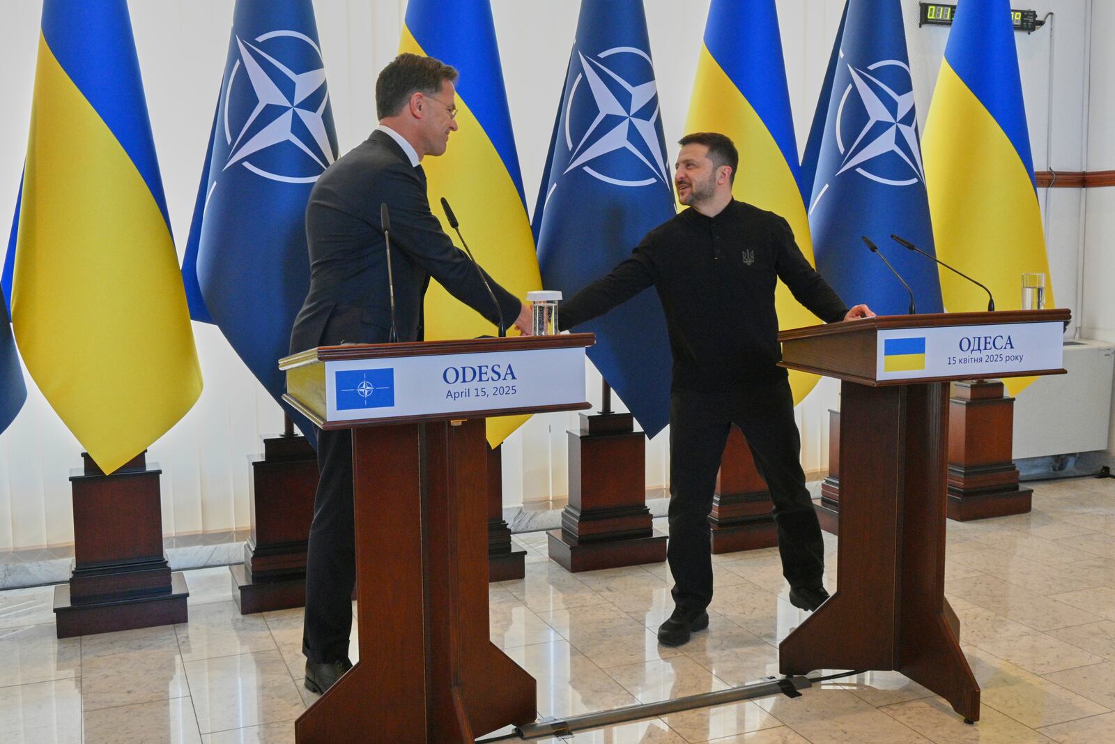 NATO Secretary General Mark Rutte, left, and Ukraine's President Volodymyr Zelenskyy shake hands before their joint press conference in Odesa, Ukraine, Tuesday, April 15, 2025. (AP Photo/Michael Shtekel)
