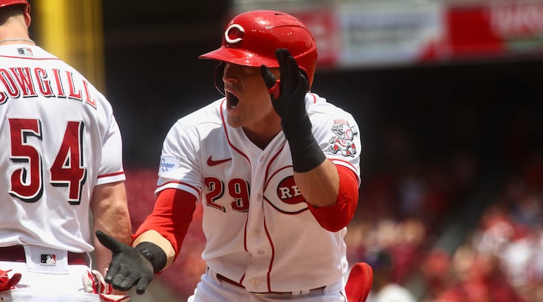 TJ Friedl, of the Reds, celebrates after driving in the tying run with a single in the fifth on Wednesday, June 21, 2023, against the Colorado Rockies at Great American Ball Park in Cincinnati. David Jablonski/Staff