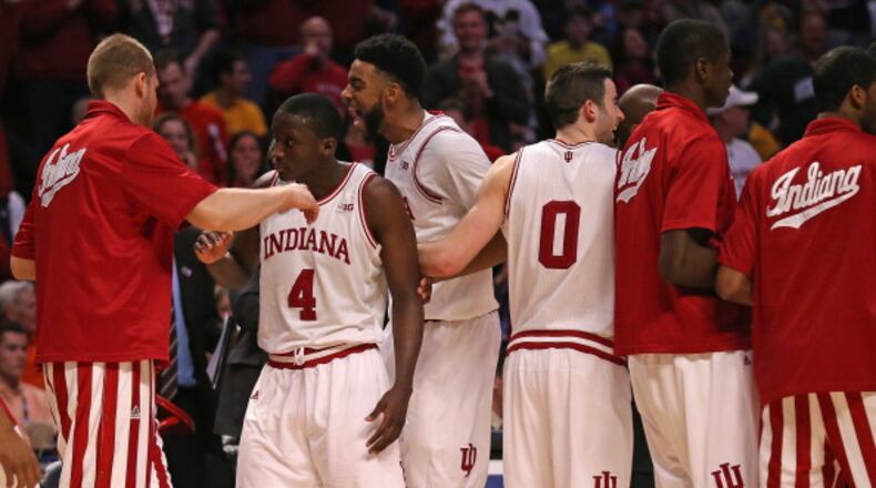 CHICAGO, IL - MARCH 15: Victor Oladipo #4 of the Indiana Hoosiers celebrates with teammates, inlcuding Christian Watford #2 and Will Sheehey #0, after dunking on the Illinois Fighting Illini during a quarterfinal game of the Big Ten Basketball Tournament at the United Center on March 15, 2013 in Chicago, Illinois. Indiana defeated Illinois 80-64. (Photo by Jonathan Daniel/Getty Images)