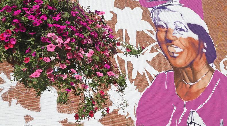 The mural of Hattie Moseley, a Springfield civil rights advocate, is beginning to take shape Thursday, Oct. 6, 2022. The mural is on the wall of the WesBanco branch downtown. BILL LACKEY/STAFF