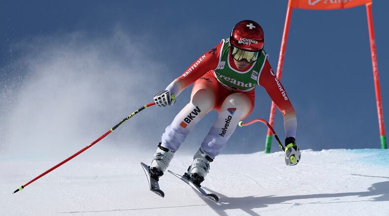 Switzerland's Corinne Suter speeds down the course during an alpine ski, women's World Cup downhill, in Soldeu, Andorra, Friday, February. 27, 2026. (AP Photo/Gabriele Facciotti)