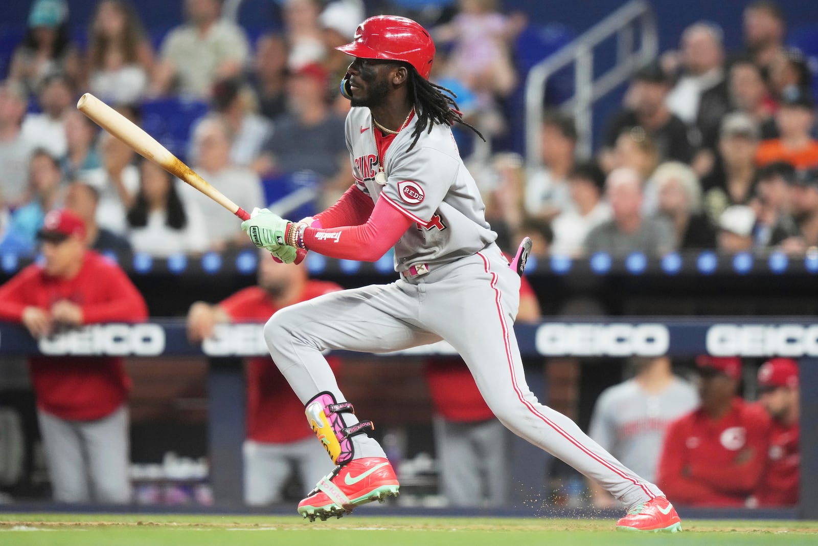 Cincinnati Reds' Elly De La Cruz follows through on a single during the sixth inning of a baseball game against the Miami Marlins, Tuesday, April 22, 2025, in Miami. (AP Photo/Lynne Sladky)