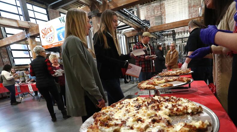 The third annual Slice of Springfield fundraiser will be held on Thursday at Mother Stewart's Brewery. Last year, hundreds of people showed up for the event to sample pizza from area pizza shops and vote for their favorite while raising money for a great cause. BILL LACKEY/STAFF