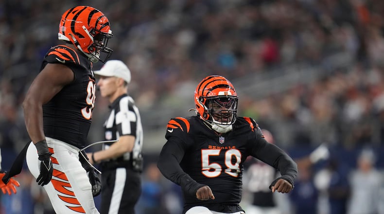 Cincinnati Bengals defensive end Joseph Ossai (58) celebrates sacking Dallas Cowboys quarterback Cooper Rushduring the first half of an NFL football game, Monday, Dec. 9, 2024, in Arlington, Texas. (AP Photo/Julio Cortez)