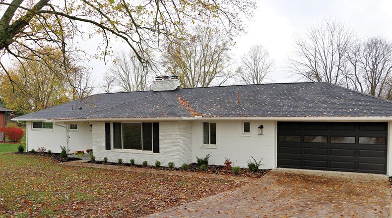 Listed for $374,900 by RE/MAX Victory and Associates, the painted-brick ranch at 5633 Little Sugarcreek Road has about 2,047 square feet of living space, plus the finished half of the basement. CONTRIBUTED