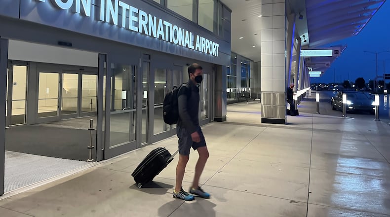 A passenger exits the Dayton International Airport. CORNELIUS FROLIK / STAFF