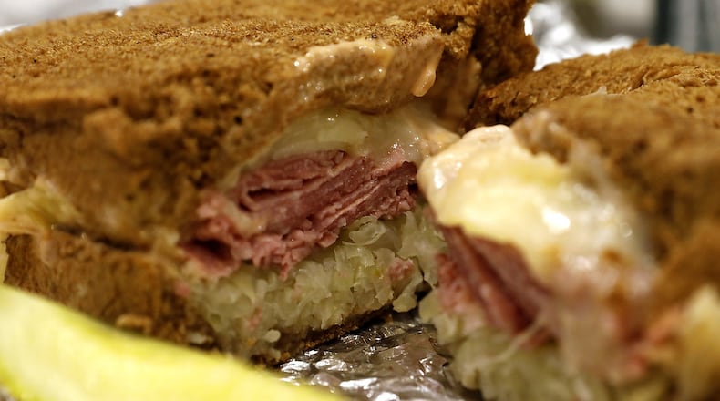 A Mike and Rosy’s Reuben sandwich piled high with meat, cheese and sauerkraut. BILL LACKEY/STAFF