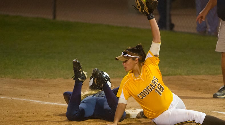 OHIO PRESS PHOTO SYSTEM SPECIAL TO THE DAYTON DAILY NEWS-Kenton Ridge second baseman shows the umpire the ball after tagging Granville base runner Taylor Drumm out during the third inning of the Ohio High School Div. II softball semi-final, against Granville, in Akron, Friday, June 7, 2013. Kenton Ridge won 1-0. (PHIL LONG/OHIO PRESS PHOTO SYSTEM)