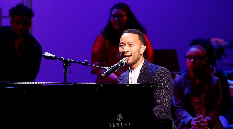 John Legend performs on stage during a concert following the ribbon cutting for the new John Legend Theater. Bill Lackey/Staff