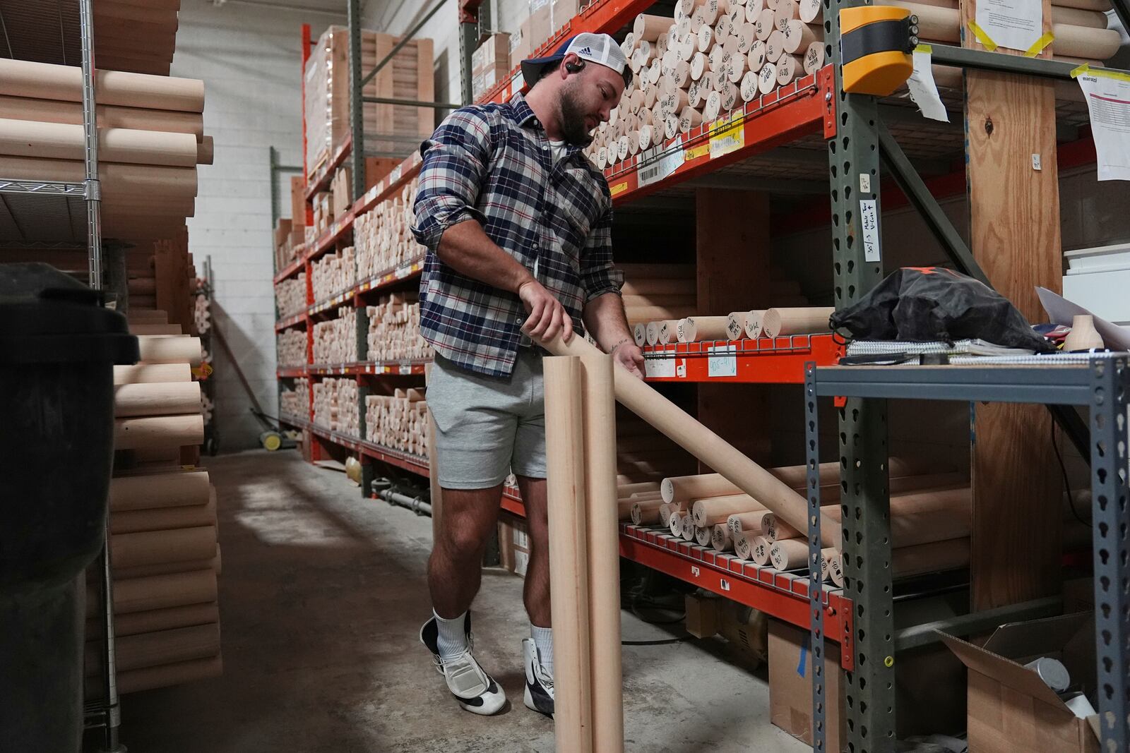 Tom Fazzini selects wood to be manufactured into a torpedo baseball bat at Victus Sports in King of Prussia, Pa., Wednesday, April 2, 2025. (AP Photo/Matt Rourke)