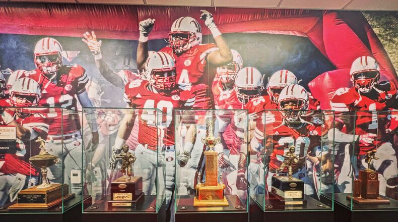 Trophies are pictured in the Wittenberg football coaches' offices on Wednesday, Sept. 14, 2022, in Springfield. David Jablonski/Staff