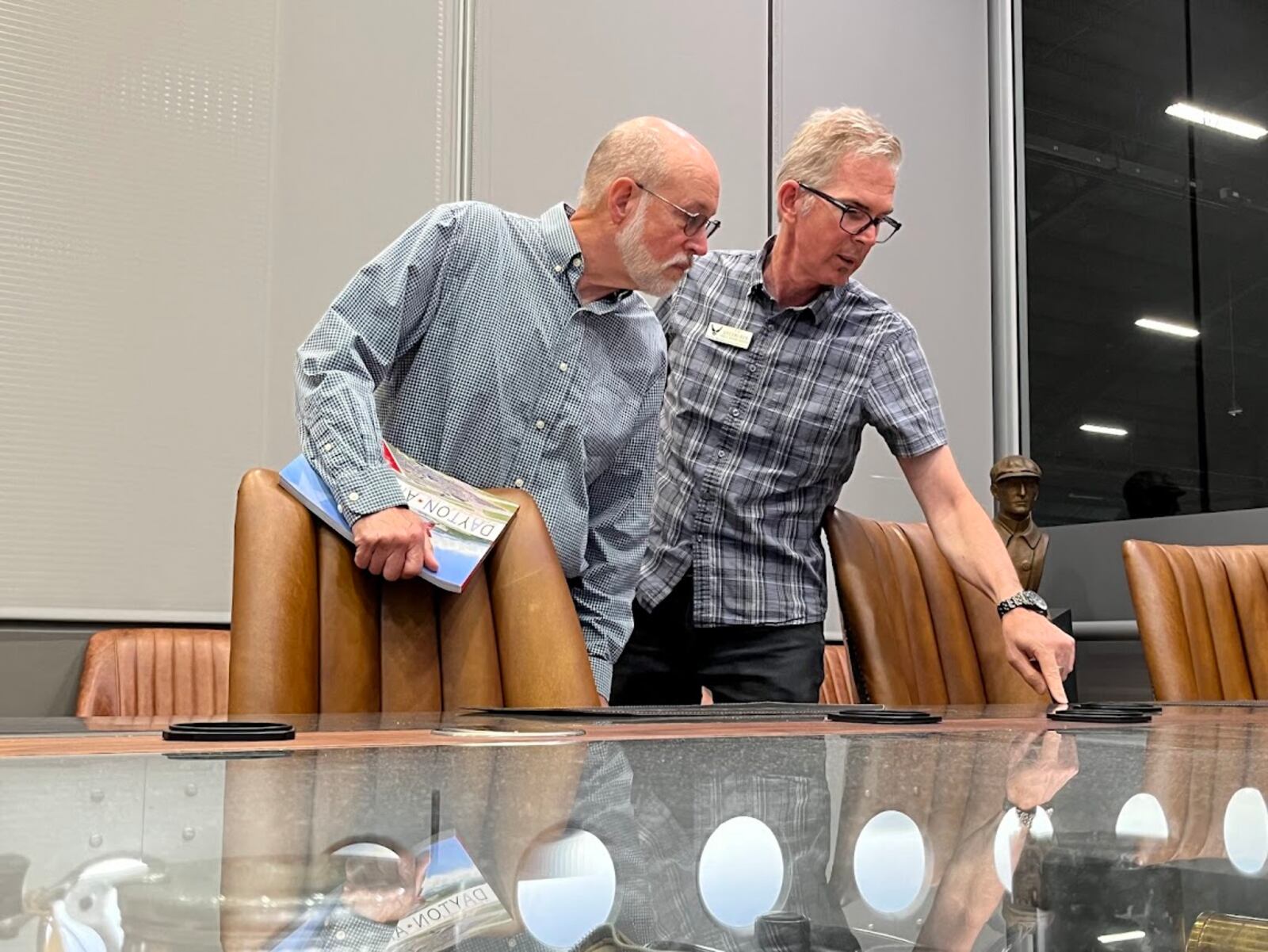 Timothy Gaffney (left) and Ty Greenlees, both retired from the Dayton Daily News, at a conference room at the National Musuem of the U.S. Air Force. THOMAS GNAU/STAFF