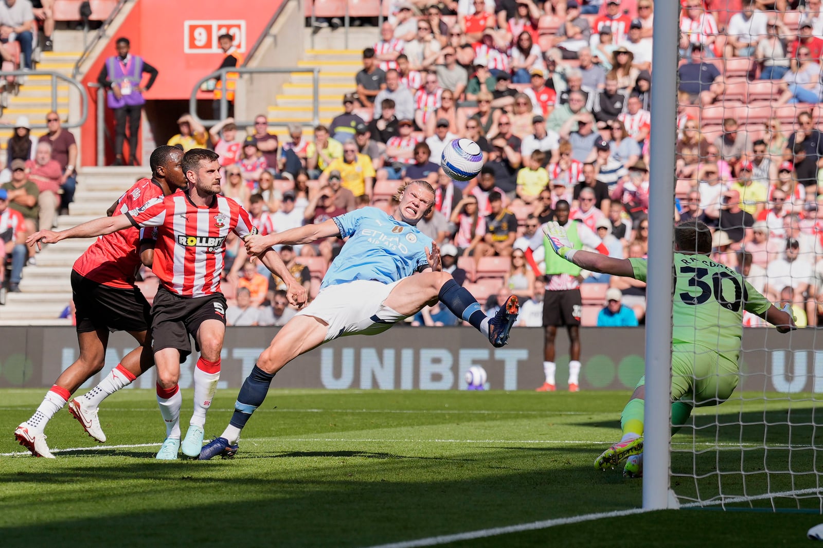 Manchester City's Erling Haaland, center, attempts a shot on goal during their Premier League soccer match at St Mary's Stadium, Southampton, England, Saturday May 10, 2025. (Andrew Matthews/PA via AP)