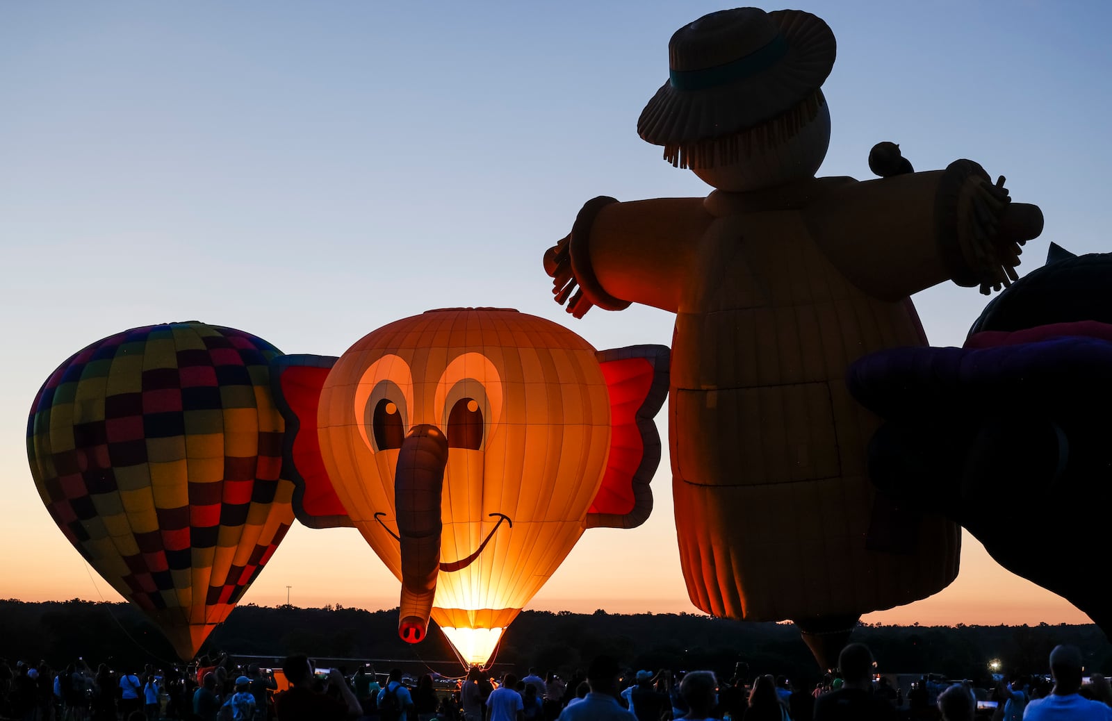 The Ohio Challenge Hot Air Balloon and Skydiving Festival kicked off the weekend event Friday, July 19, 2024 at Smith Park in Middletown with balloon launch and glow, flag and pyrotechnics jumps by Team Fastrax, fireworks show by Yokum Fireworks, a drone show and more. NICK GRAHAM/STAFF