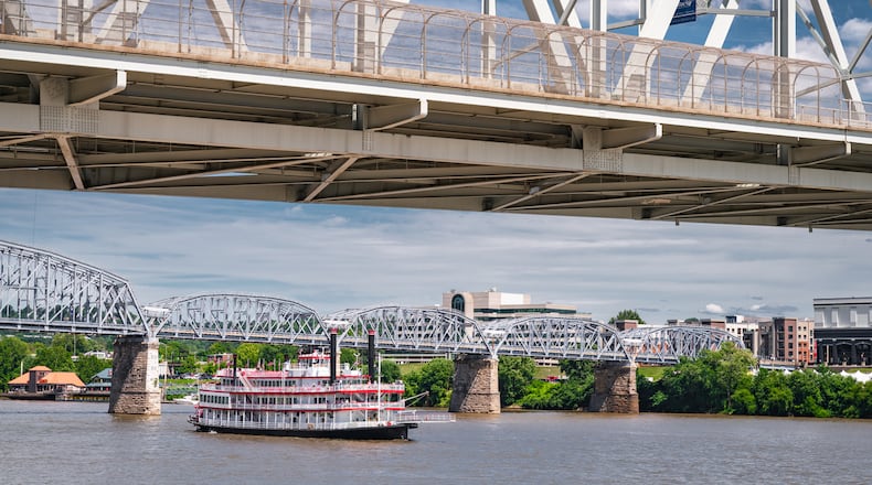 A vintage paddle steamboat cruises down the Ohio River in Cincinnati. ISTOCK