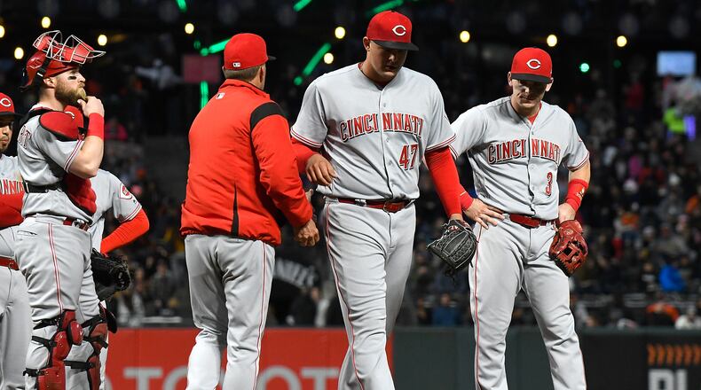 SAN FRANCISCO, CA - MAY 14: Interim manager Jim Riggleman #35 of the Cincinnati Reds takes the ball from starting pitcher Sal Romano #47 taking Romano out of the game against the San Francisco Giants in the bottom of the third innng at AT&T Park on May 14, 2018 in San Francisco, California. (Photo by Thearon W. Henderson/Getty Images)