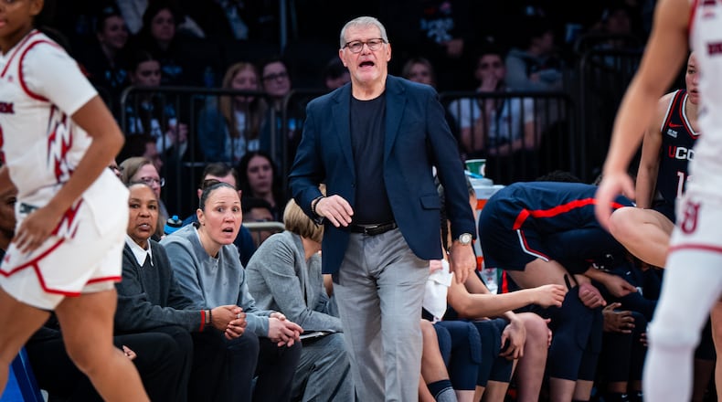 UConn head coach Geno Auriemma, center, instructs his team from the sideline during the second half of an NCAA college basketball game against St. John's, Sunday, March 1, 2026, in New York. (AP Photo/Angelina Katsanis)