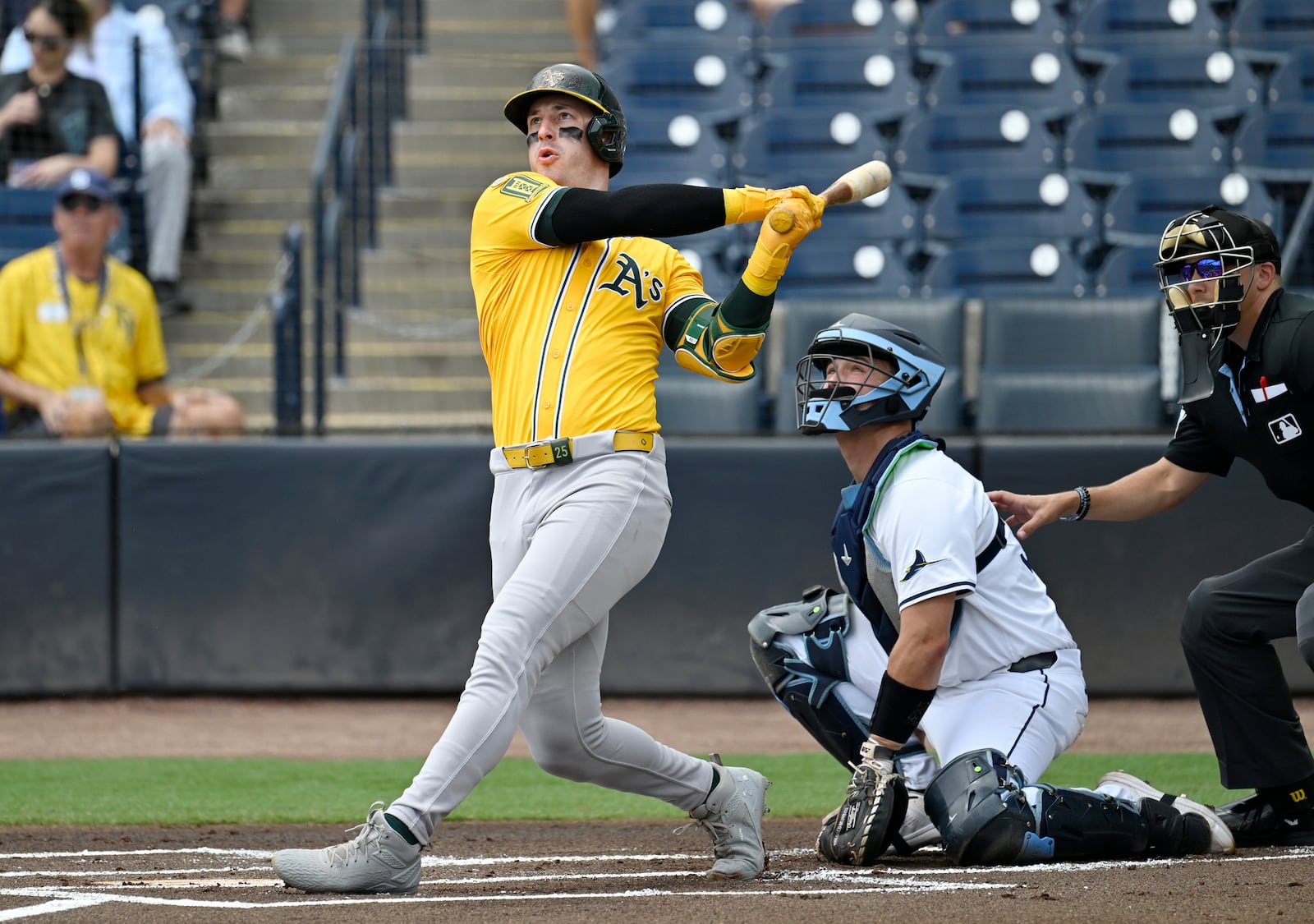 Athletics' Brent Rooker hits a solo home run during the first inning of a baseball game against the Tampa Bay Rays, Wednesday, July 2, 2025, in Tampa, Fla. (AP Photo/Jason Behnken)