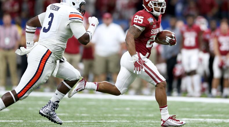 Joe Mixon  hasn't even worn a Bengals uniform yet, but there are plenty of fantasy football pundits who believe the rookie from Oklahoma should be the first running back chosen from Cincinnati's roster.  Here, he's running away from the Auburn Tigers in the AllState Sugar Bowl.