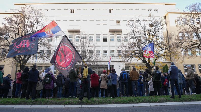 People attend a protest in front of a prosecutor's office for organized crime after Serbian lawmakers last week passed a special law clearing the way for a controversial real estate project that would be financed by an investment company linked to President Trump's son-in-law Jared Kushner, in Belgrade, Serbia, Thursday, Nov. 20, 2025. (AP Photo/Darko Vojinovic)