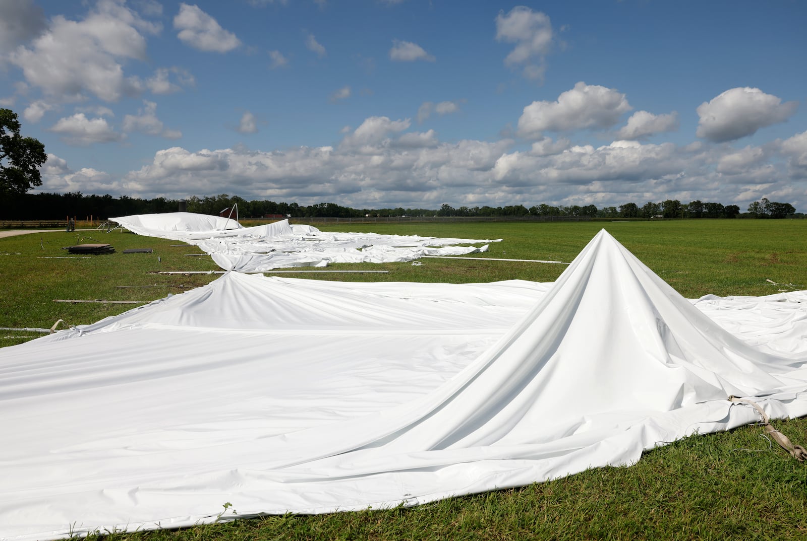 The aftermath as seen on Thursday, June 19, 2025, of a tent that was damaged during a storm in New Carlisle. JOSEPH COOKE/STAFF
