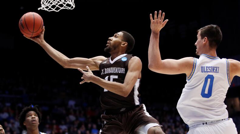 DAYTON, OH - MARCH 13: LaDarien Griffin #15 of the St. Bonaventure Bonnies scores a layup past Alex Olesinski #0 of the UCLA Bruins during the second half of the First Four game in the 2018 NCAA Men’s Basketball Tournament at UD Arena on March 13, 2018 in Dayton, Ohio. (Photo by Joe Robbins/Getty Images)