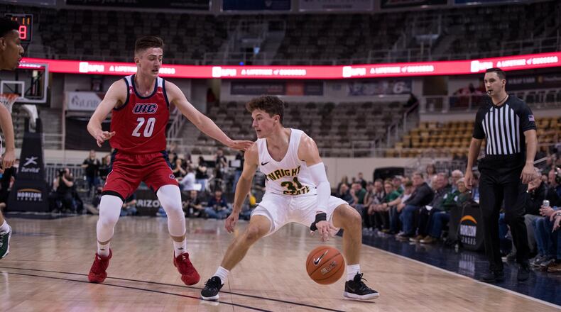 Wright State’s Cole Gentry is guarded by UIC’s Jamie Ahale during Monday’s Horizon League semifinal at Indiana Farmers Coliseum in Indianapolis. Joseph Craven/WSU Athletics
