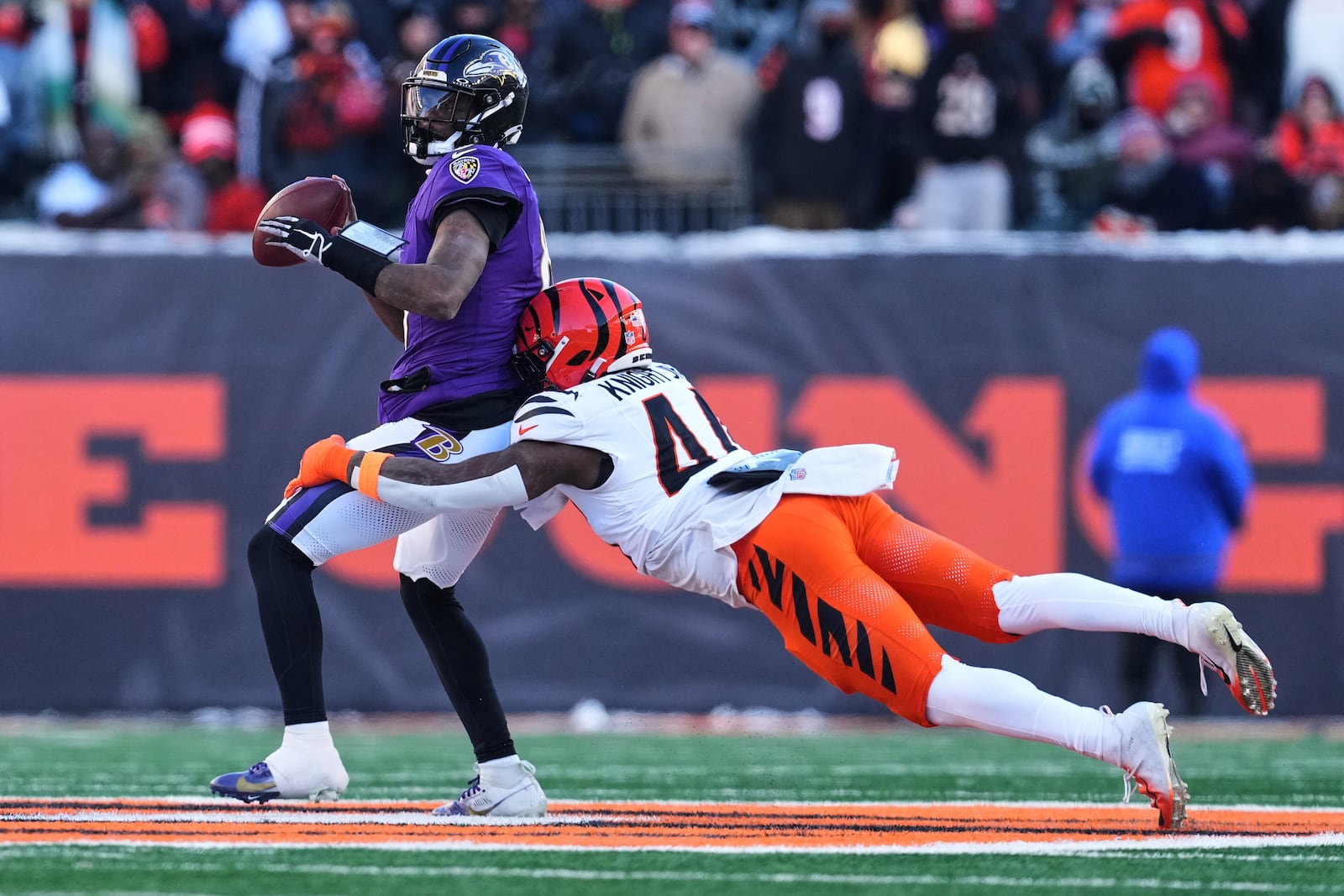 Cincinnati Bengals linebacker Demetrius Knight Jr. (44) sacks Baltimore Ravens quarterback Lamar Jackson (8) during the second half of an NFL football game, Sunday, Dec. 14, 2025, in Cincinnati. (AP Photo/Jeff Dean)