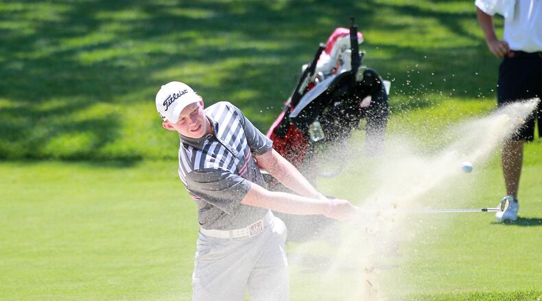 Maxwell Moldovan of Uniontown hits a bunker shot on the 18th hole in the final round of the 113th Ohio Amateur on Friday at Moraine Country Club. The Ohio State recruit fired a final-round 69 to edge Scott Anderson of Columbus by one shot to win the title. John Boyle/STAFF