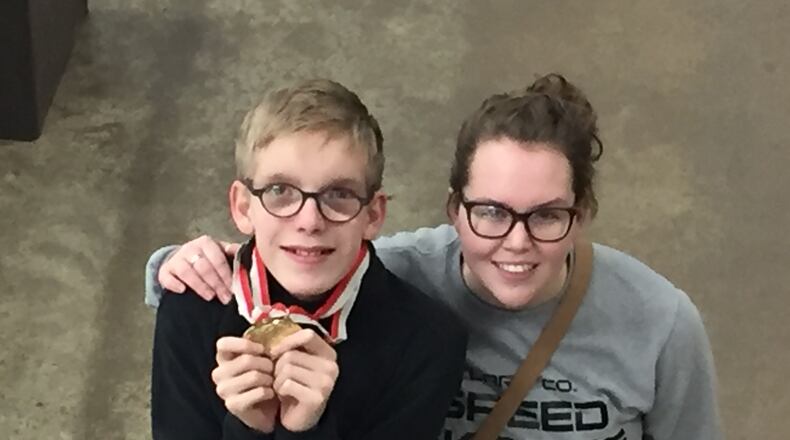 Thomas Marshall received gold medals in the 1,000 and 1,500 meter speed skating events at the Ohio Special Olympics Winter Games. Thomas, pictured with his sister/coach Ellie Marshall, was the only athlete representing Clark County at the event. Contributed photo