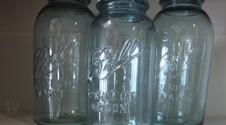 Once strictly utilitarian, familiar canning jars take on new decorative lives at the Funk Junk Boutique in Sevile, Ohio. (Michael Chritton/Akron Beacon Journal/TNS)