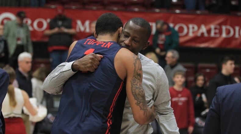 Dayton’s Anthony Grant hugs Obi Toppin after a victory against Saint Joseph’s on Sunday, Jan. 5, 2020, at Hagan Arena in Philadelphia. David Jablonski/Staff