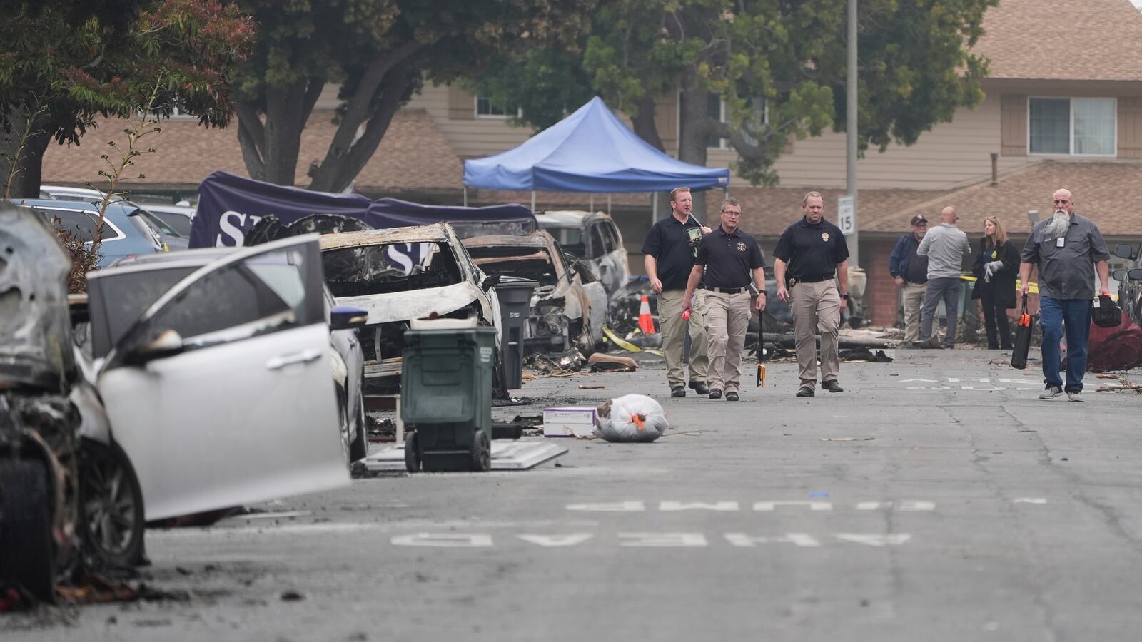 Investigators work at the site of a plane crash Friday, May 23, 2025, in San Diego. (AP Photo/Gregory Bull)