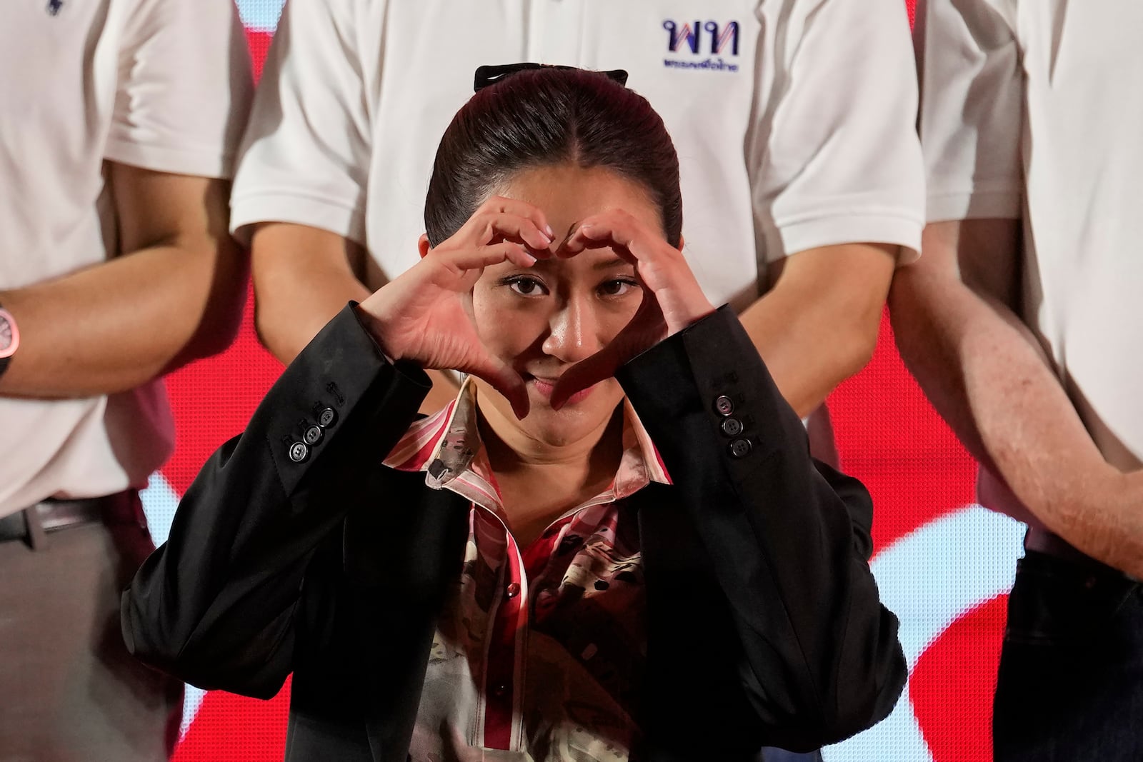 FILE - Paetongtarn Shinawatra, one of the opposition Pheu Thai party's top politicians and youngest daughter of exiled former deposed Thai leader Thaksin Shinawatra, gestures to supporters during a general election campaign in Bangkok, Thailand, on March 24, 2023. (AP Photo/Sakchai Lalit, File)