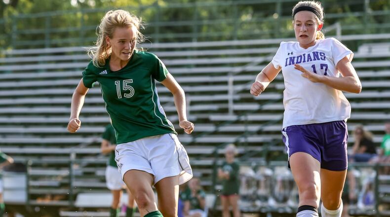 Catholic Central High School senior Caitlin Foley knocks a ball into the net during their game against Mechanicsburg on Sept. 19 at Hallinean Field. Foley scored on the play as the Irish won 6-0. CONTRIBUTED PHOTO BY MICHAEL COOPER