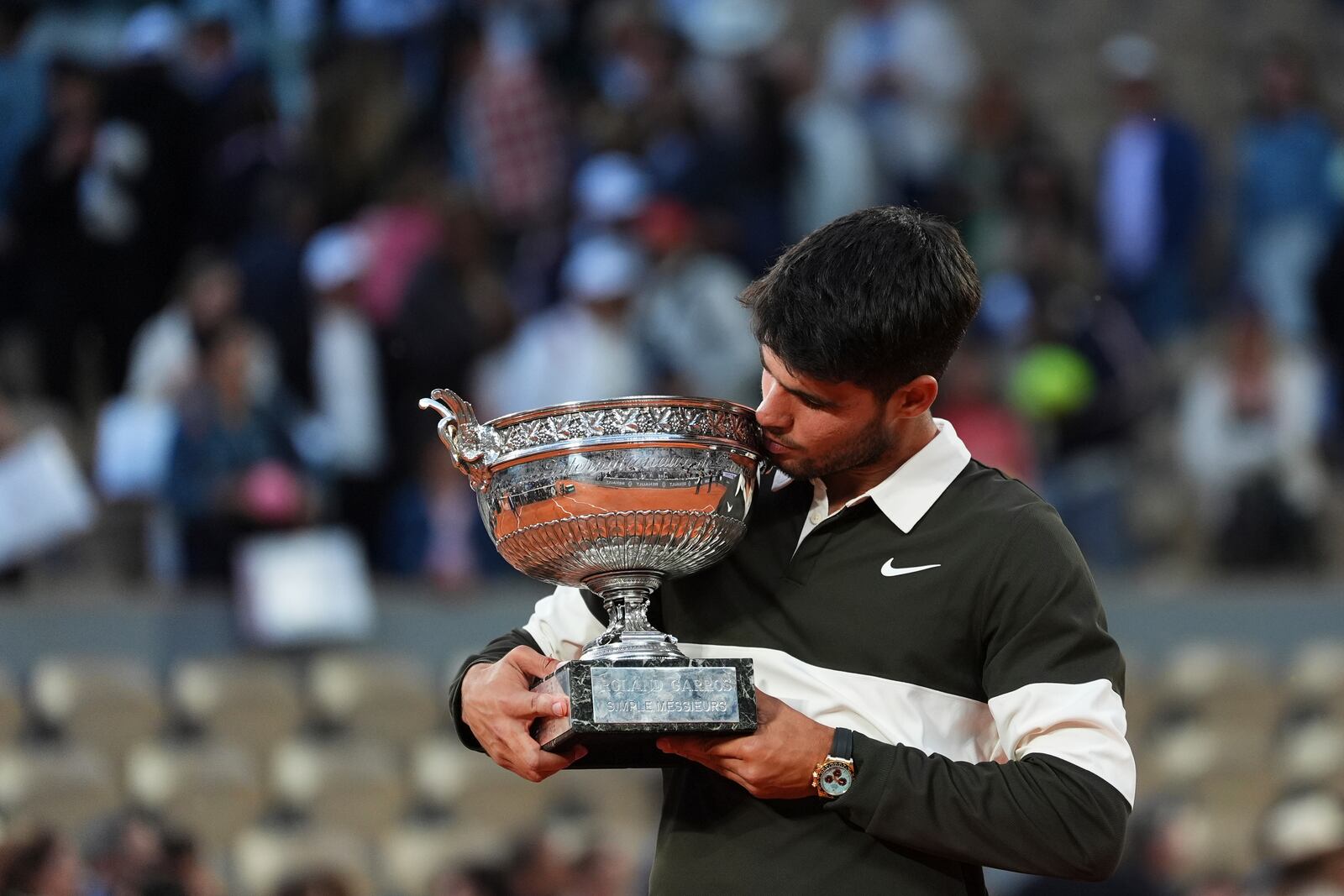 Spain's Carlos Alcaraz celebrates with the trophy after winning the final match of the French Tennis Open against Italy's Jannik Sinner at the Roland-Garros stadium in Paris, Sunday, June 8, 2025. (AP Photo/Lindsey Wasson)
