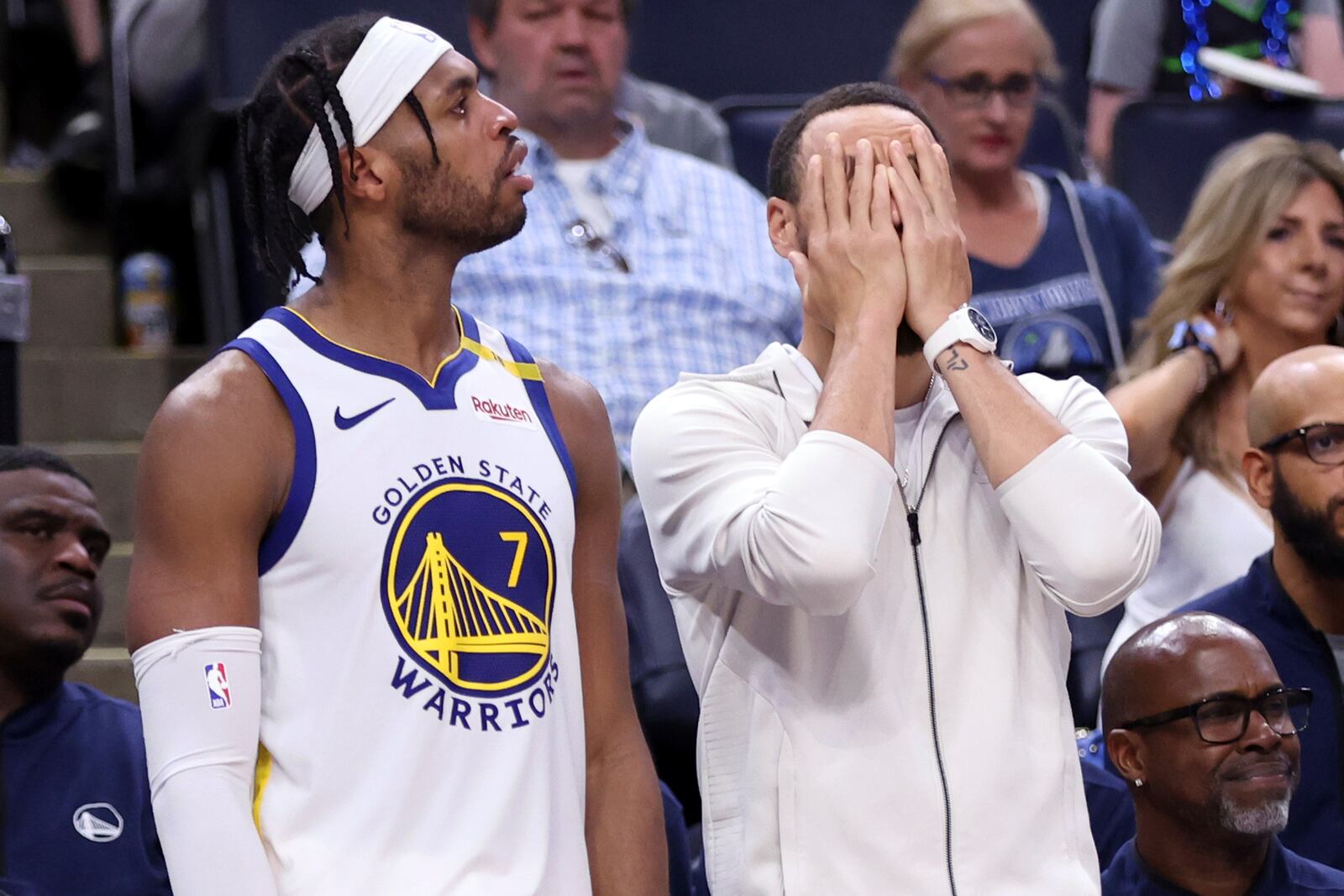 Golden State Warriors' Stephen Curry, right, and Buddy Hield react to a missed shot in the second half of Game 5 of an NBA basketball second-round playoff series, Wednesday, May 14, 2025, in Minneapolis. (Scott Strazzante/San Francisco Chronicle via AP)