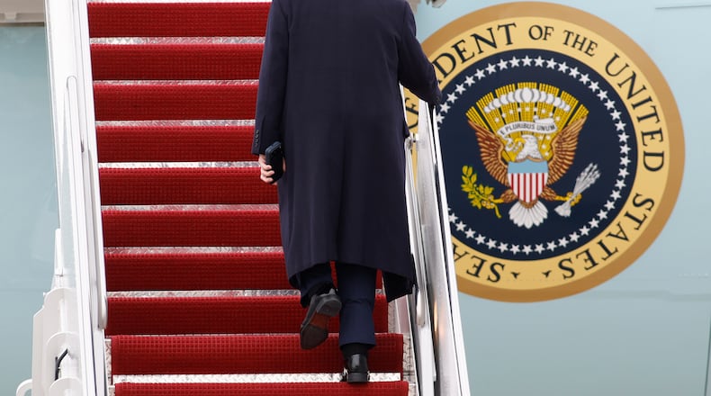 President Donald Trump walks up the stairs of Air Force One at Joint Base Andrews, Md., Friday, March 27, 2026. (AP Photo/Luis M. Alvarez)