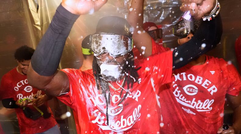 Cincinnati Reds' Elly De La Cruz celebrates after making it into the playoffs after a baseball game against the Milwaukee Brewers Sunday, Sept. 28, 2025, in Milwaukee. (AP Photo/Morry Gash)