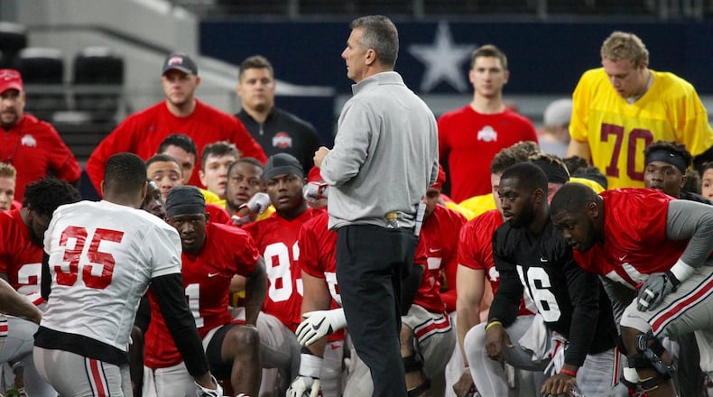 Ohio State’s Urban Meyer talks to the team at practice at AT&T Stadium on Tuesday, Dec. 26, 2017, in Arlington, Texas. David Jablonski/Staff