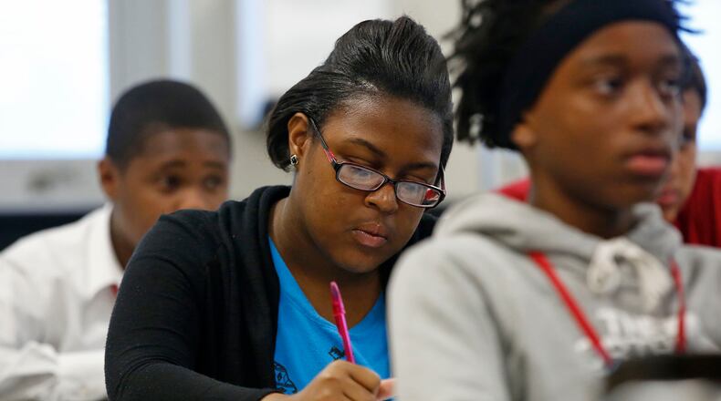 Ta'nesha Holden, 17, takes notes during the Montgomery County YouthWorks Summer Program at Pontiz Career Technology Center where instructor Mark Anderson teaches job readiness skills through Montgomery County Workforce Development. TY GREENLEES / STAFF
